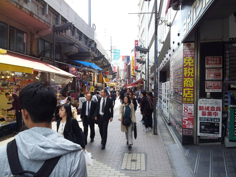 Entering Ameya-Yokochō market under the Yamanote Line tracks.