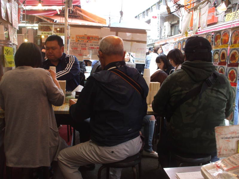 Other diners at a small restaurant in the Ameya-Yokochō market under the Yamanote Line tracks.