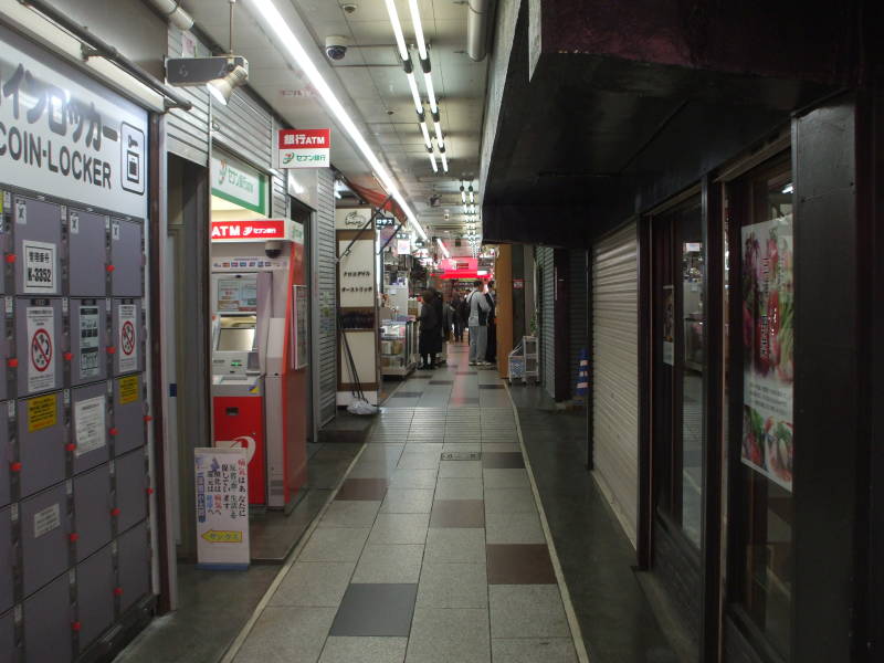 Shops in enclosed passageways in Ameya-Yokochō market under the Yamanote Line tracks.