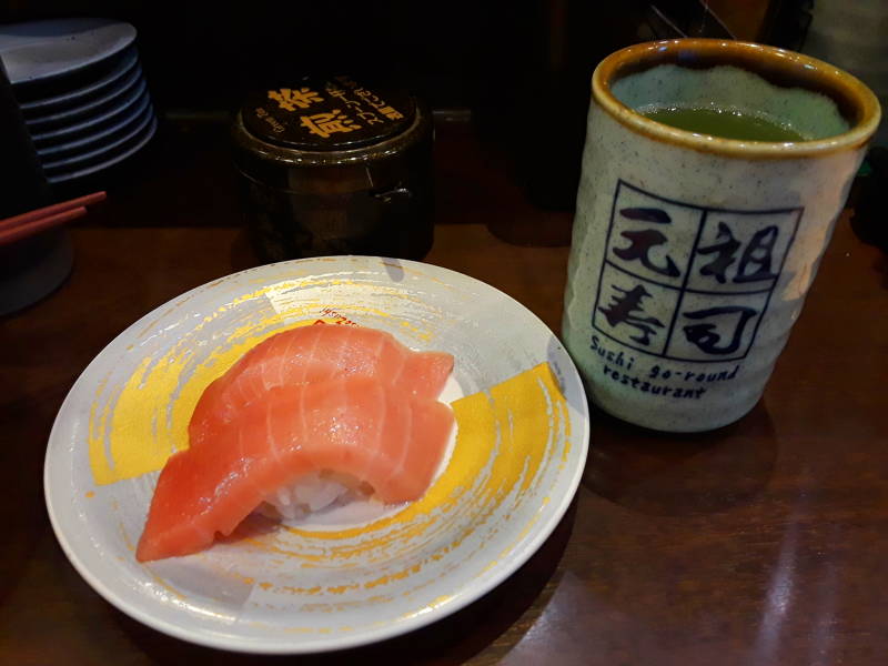 Matcha or green tea powder at the Sushi Train or Sushi-Go-Round or Conveyor Belt Sushi, in Asakusa, Tōkyō, Japan.