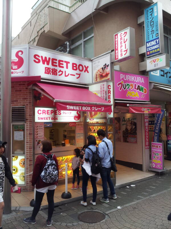 Pink crepe shop and storage lockers on Takeshita-dori or Takeshita Street in Harajuku.