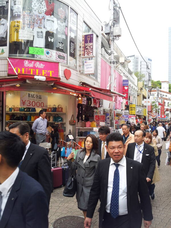 Lanyarded salarymen on Takeshita-dori or Takeshita Street in Harajuku.