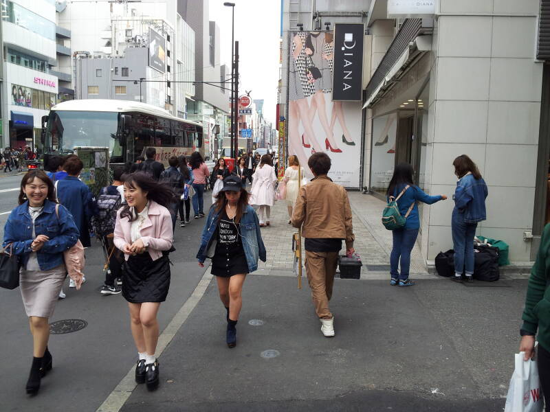 Crowds along the busy street east of Takeshita-dori or Takeshita Street in Harajuku.