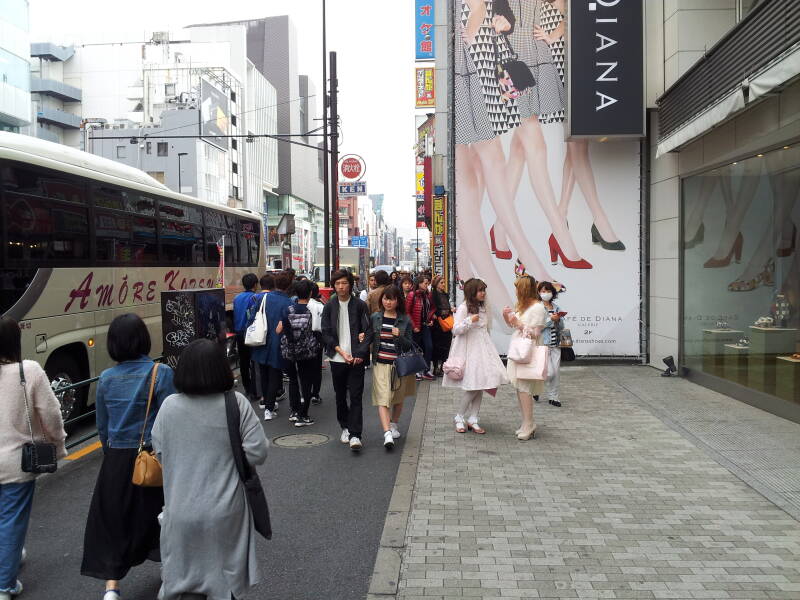 Crowds along the busy street east of Takeshita-dori or Takeshita Street in Harajuku.