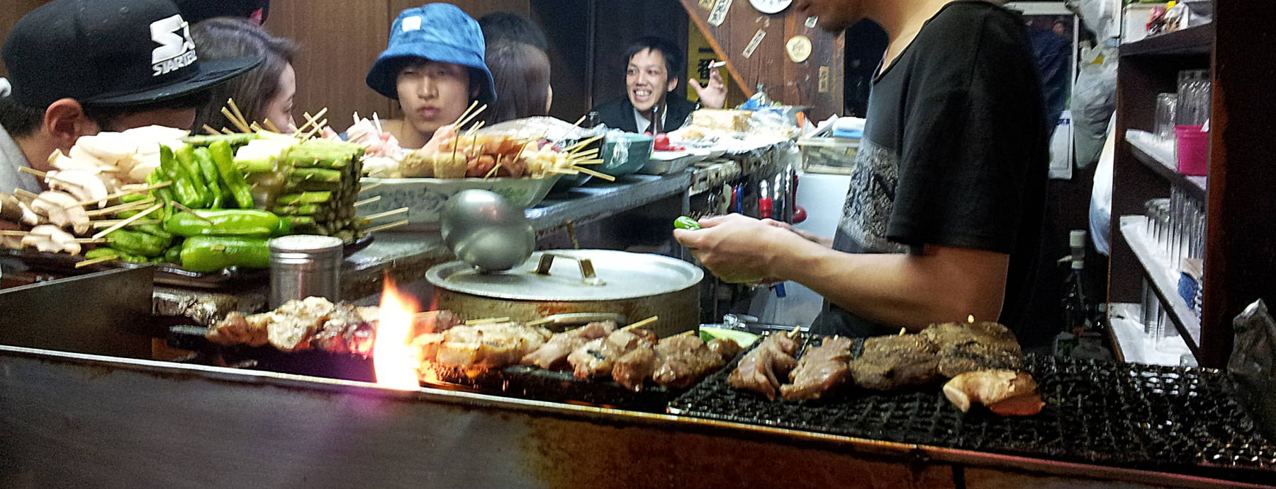 Happy diners in an izakaya in Omoide Yokochō, Memory Alley (or Piss Alley) in Tōkyō.