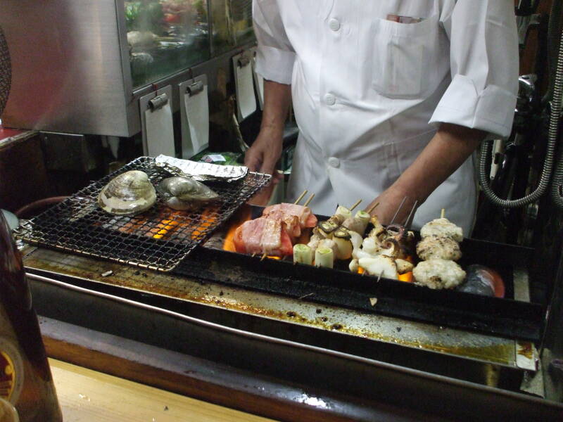 Various seafood on the grill at a small izakaya in Omoide Yokochō, Shinjuku, Tōkyō
