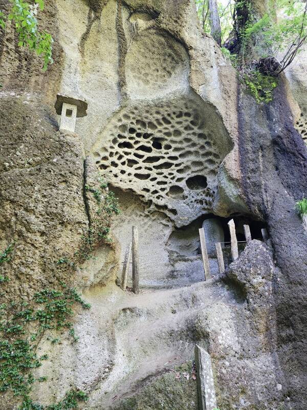 Buddhist shrines in the strangely eroded cliff faces at the Tarumizu ruins.