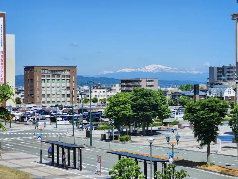 Snow-covered mountains in the distance northwest of Yamagata Station.