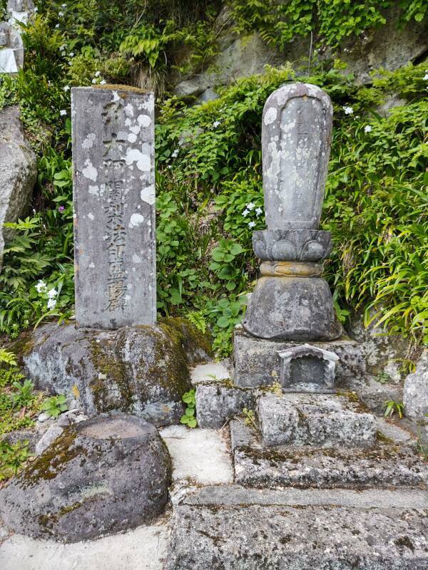 Grave and memorial markers at Yamadera temple complex.
