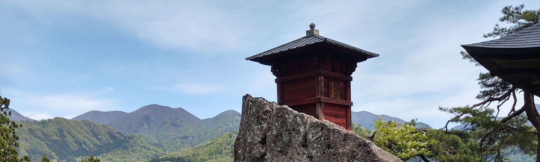 Sutra repository on a rock peak at Yamadera, overlooking the valley and the mountains to the south.