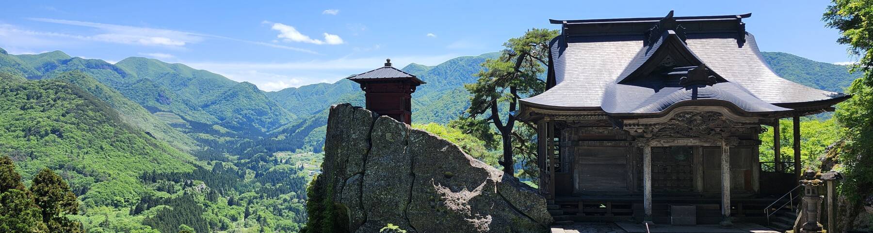 Sutra repository on a rock peak at Yamadera, overlooking the valley and the mountains to the south.