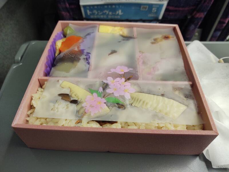 Opening a bentō lunch on board the Shinkansen.