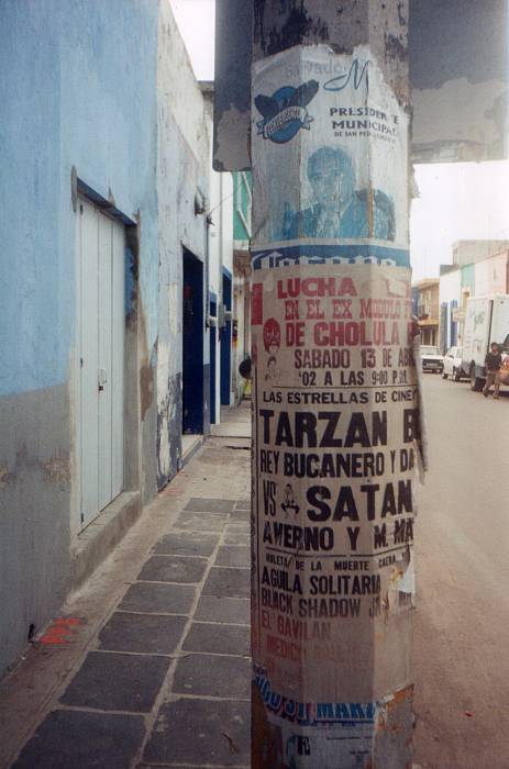 Lucha libre poster, or masked Mexican wrestling poster, in Cholula, Mexico.  Many lucha libre or Mexican wrestling stars are listed: Tarzan Boy, Bucanero, and Satan.