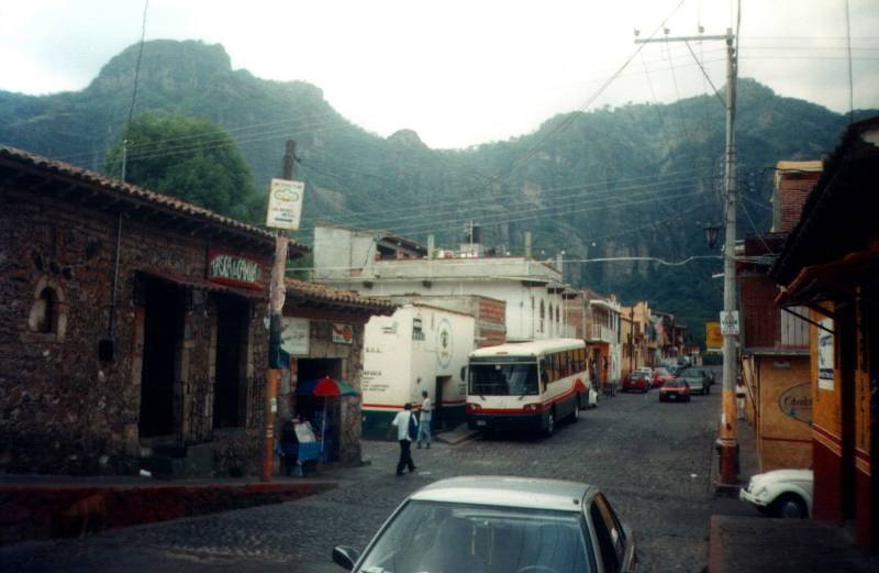 A bus comes down the main street in the Mexican town of Tepoztlán.