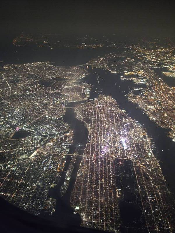 New York City from the air at night, looking south over Manhattan.