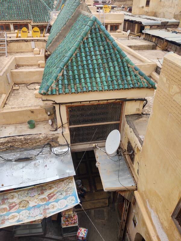 View out of window of a student room in dormitory of al-Attarine Madrasa over roofed passageways in Fez el Bali medina along Tala'a Sghira.