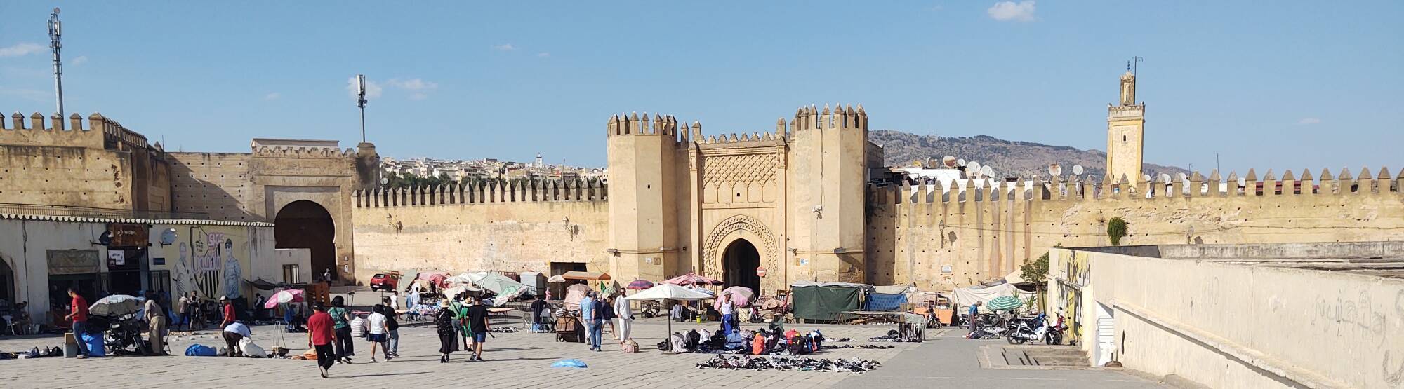 People on Place Boujloud in front of Bab Chorfa gate in Fez, Morocco.