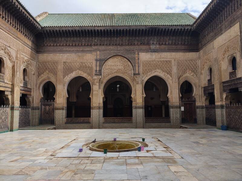 Stepping into the courtyard of the Bou Inania Madrasa in Fez.