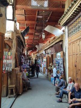 Shops in a covered souq along Tala'a Kebira in the Fez medina.