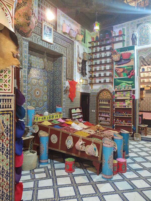 Array of spices, perfumes, and pharmaceuticals in the entryway of a spice shop in Fez el Bali medina along Tala'a Sghira.