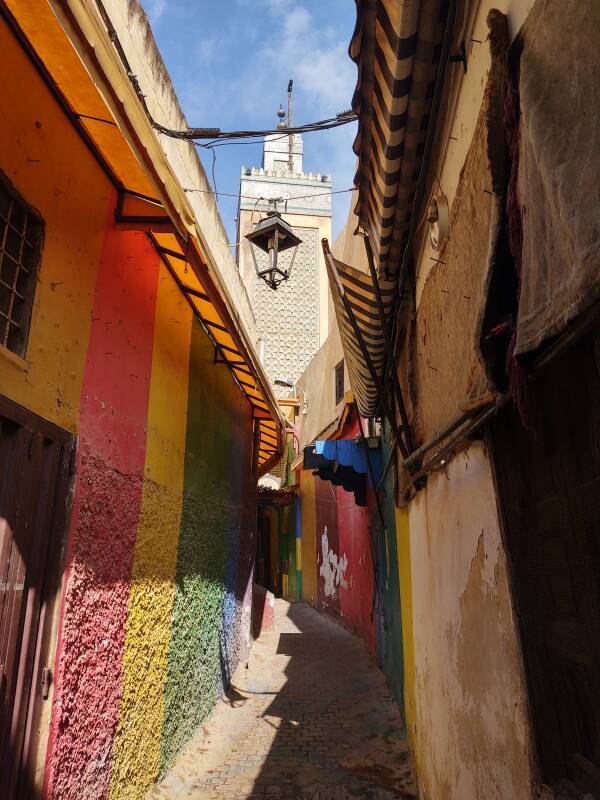 Brightly painted passageway along the clean Tala'a Sghira in Fez el Bali medina.