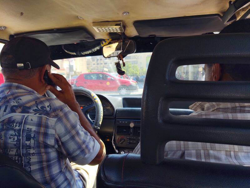 Taxi driver leaving Gare de Fez, the train station in Fez in Morocco.