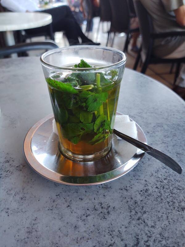 Hot sweet mint tea on the veranda of Brasserie du Café Glacier on the south side of the open square of Sāḥat Jāmi' al-Fanā', or The Mosque at the End of the World, in central Marrakech.