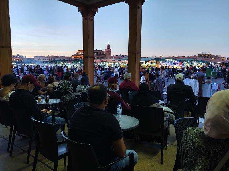 View from the veranda of Brasserie du Café Glacier on the south side of the open square of Sāḥat Jāmi' al-Fanā', or The Mosque at the End of the World, in central Marrakech.