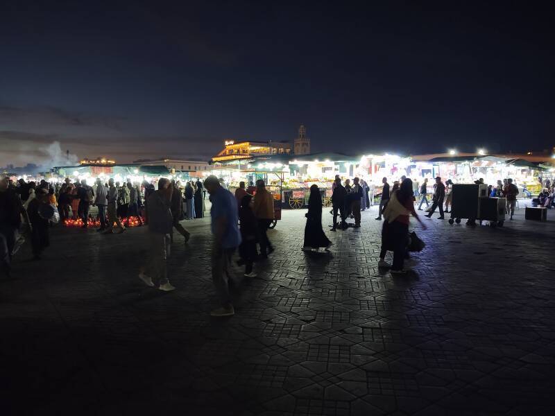 ALT: Early evening on Sāḥat Jāmi' al-Fanā', or The Mosque at the End of the World, in central Marrakech.