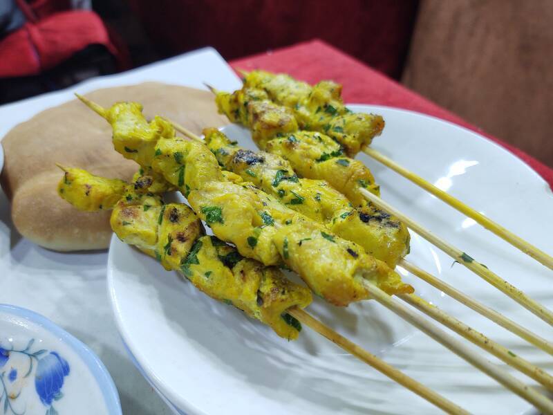 ALT: Spicy chicken skewers, dinner at a food stall on Sāḥat Jāmi' al-Fanā', or The Mosque at the End of the World, in central Marrakech.