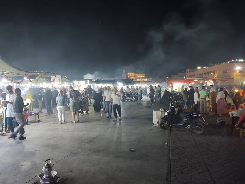 Smoke rises from cooking at the food stalls on the Sāḥat Jāmi' al-Fanā', or The Mosque at the End of the World, in central Marrakech.