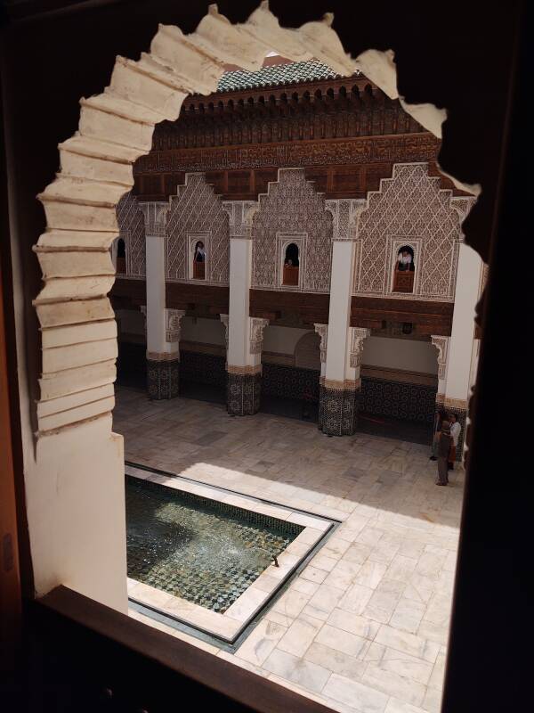 View down to the central courtyard and fountain from a student's room in the Ben Youssef madrasa in the medina of Marrakech.