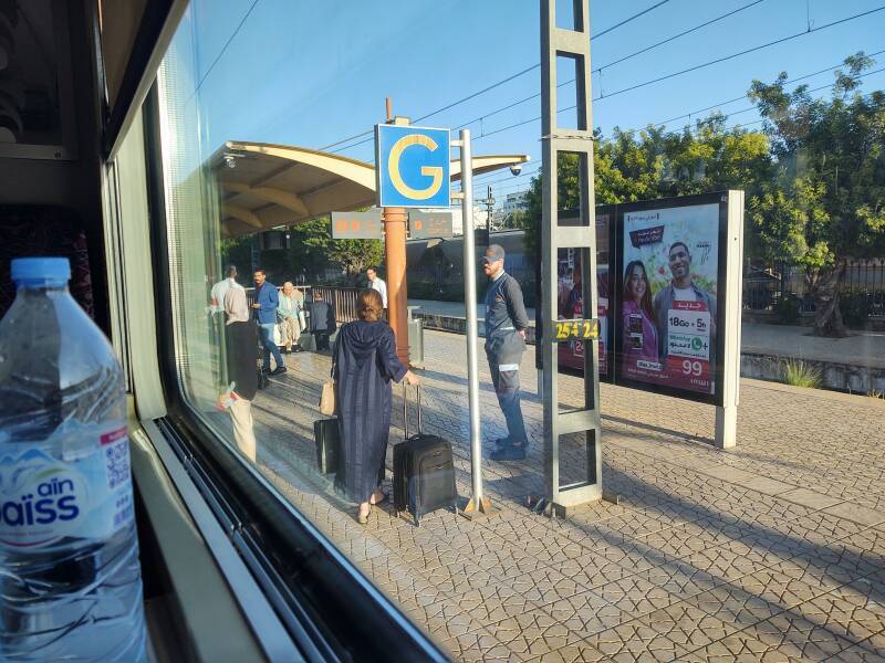 A station stop on board the train from Fez to Kénitra. By overnight train to Marrakech.