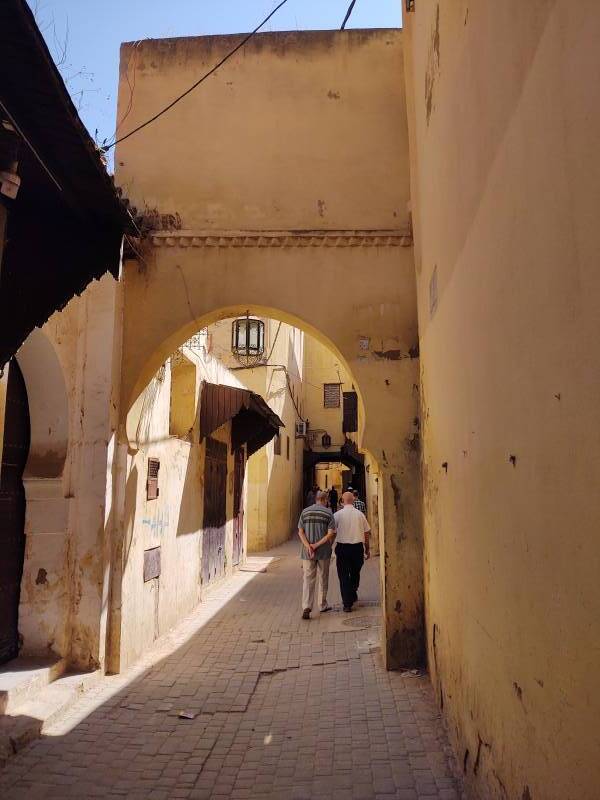 Narrow passages and elaborate doorways within the medina in Meknès.
