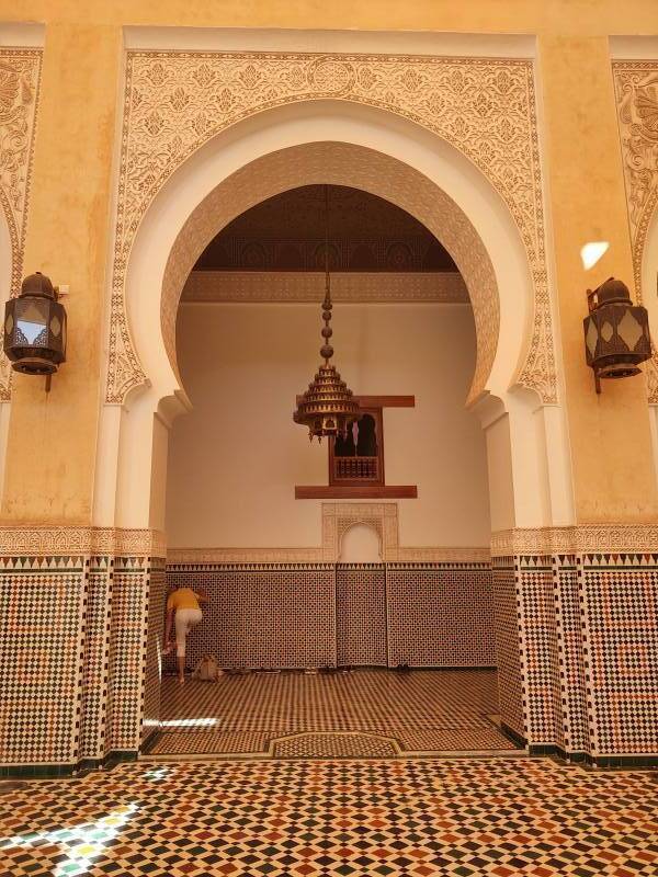 Arched opening and mihrab in the covered courtyard in the Mausoleum of Moulay Ismail.