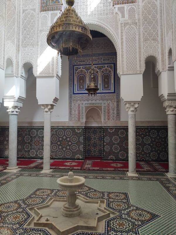 Fountain, lamp, and mihrab in the Mausoleum of Moulay Ismail.