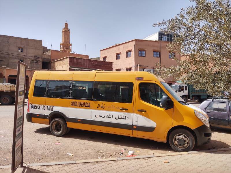 School bus and a minaret in Agouim.