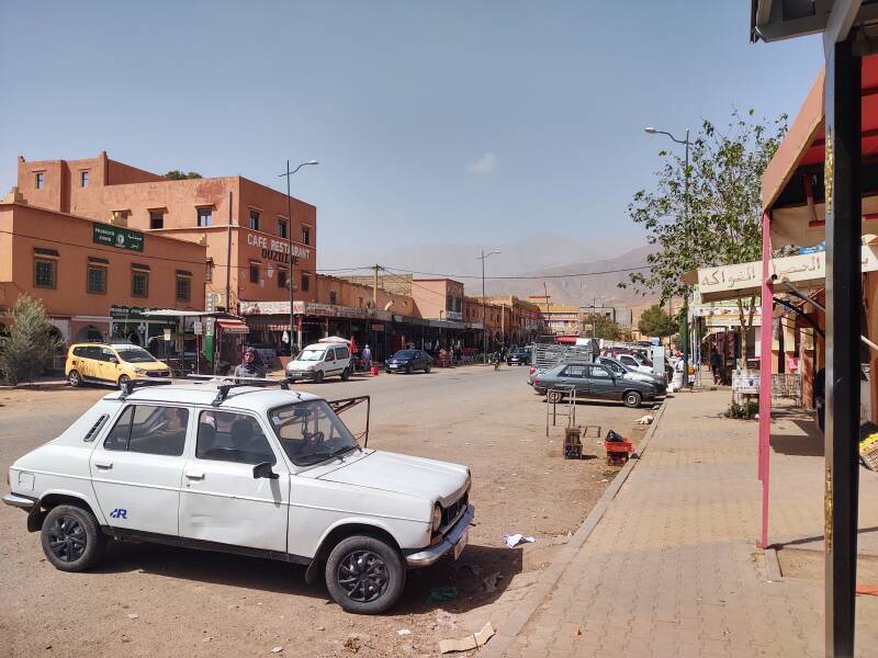 Cars and trucks on the main street through Agouim.