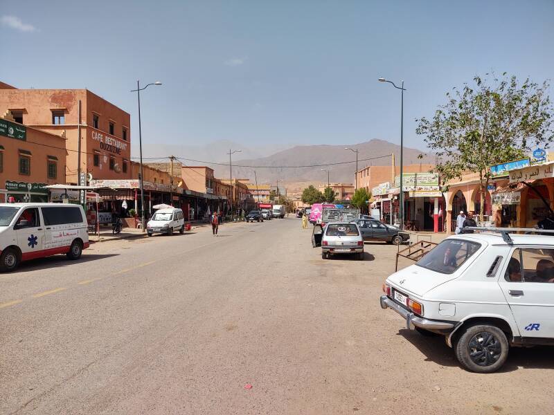 Cars and trucks on the main street through Agouim.