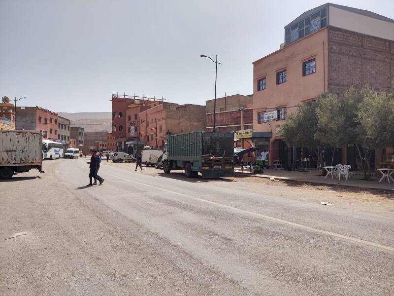 Cars and trucks on the main street through Agouim.