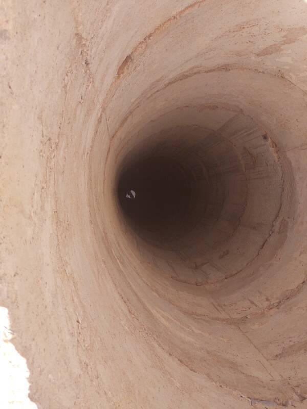 Looking down the concrete-lined well dug by the government.