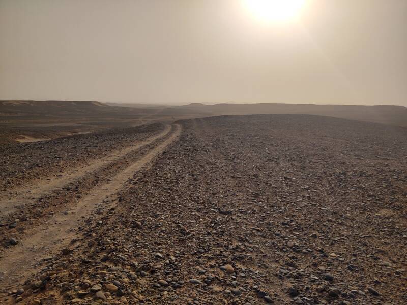 Dunes of Erg Chigaga visible in the distance.