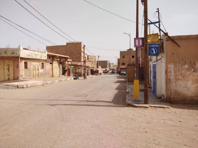 Walking east along the main street through M'Hamid.