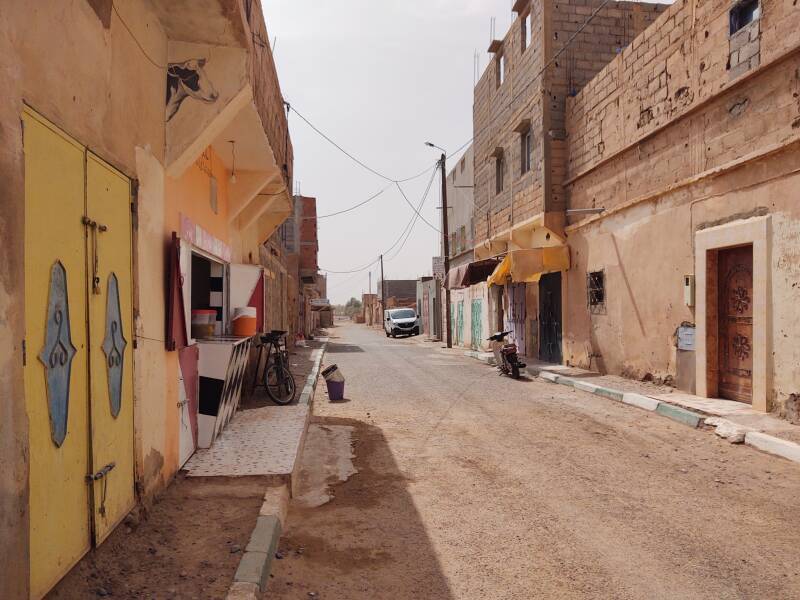 Walking east along the main street through M'Hamid.