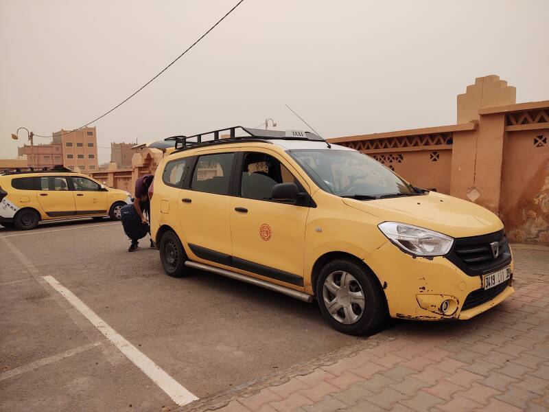 A yellow four-door grand taxi or shared cat car I rode from Zagora to M'Hamid el Ghizlane.