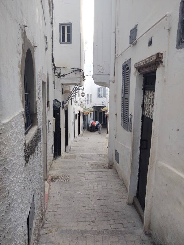A street becomes steep enough to need steps in the medina in Tangier.