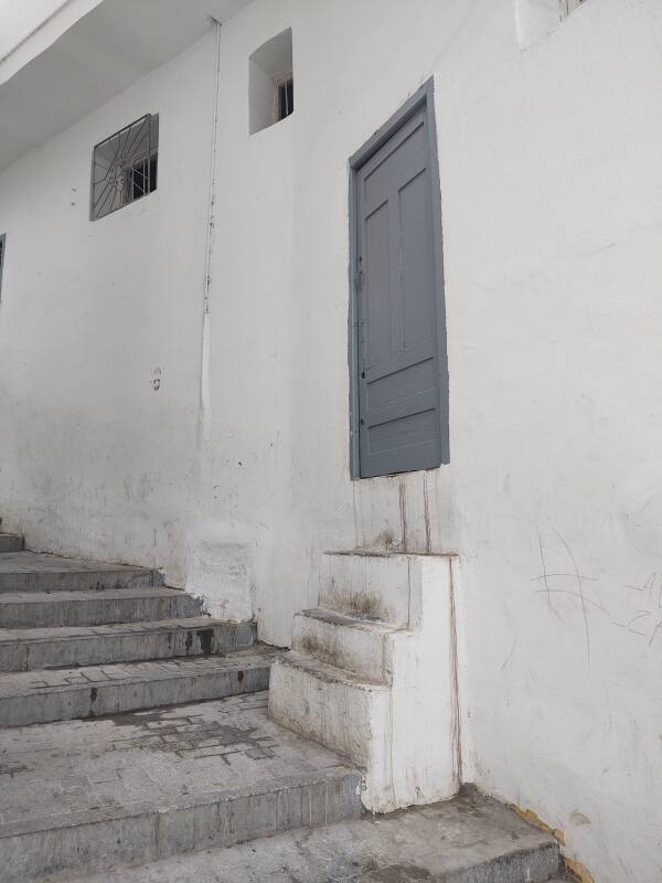 Doorway with unusually steep and narrow stairs in the medina in Tangier.