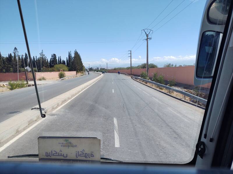 Motorcycles on the N9 national highway southeast from Marrakech, the Atlas Mountains are dimly visible in the distance.