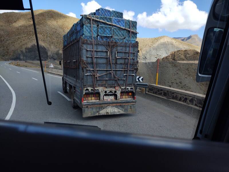 Heavily loaded truck on a twisting road through the Atlas Mountains.