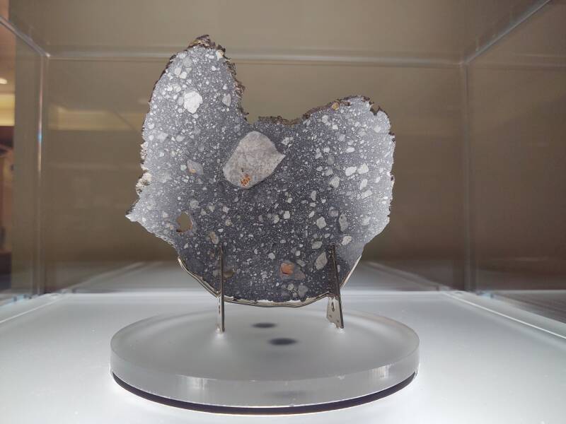 Lunar meteorite Rabt Sbayta 006, found in the Western Sahara in 2016, donated by Terry Boudreaux, Gail Koziara Boudreaux, Christopher Boudreaux, and Evan Boudreaux to the Purdue University Libraries Special Collection.